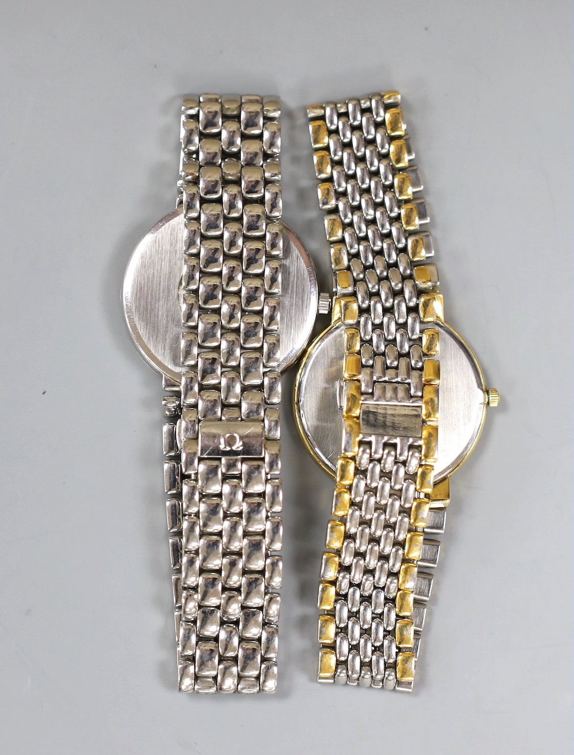 A gentleman's stainless steel Omega De Ville quartz wrist watch and a similar two tone Omega quartz wrist watch, no box or papers.